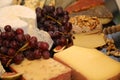 Garnished cheese plate with grapes