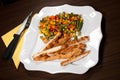 Served dinner with mexican salad of vegetables Royalty Free Stock Photo