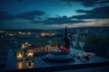 Served Dinner Table on Roof Terrace, Evening Food with Wine, Romantic Candles, Old Town View Royalty Free Stock Photo