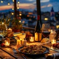 Served Dinner Table on Roof Terrace, Evening Food with Wine, Romantic Candles, Old Town View Royalty Free Stock Photo