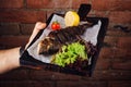 Served fried carp on wooden board