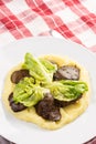 Served fried Chicken Liver with Mashed Potatoes and Lettuce