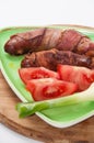 SERVED FRIED SAUSAGES WITH BACON TOMATO ONION Royalty Free Stock Photo