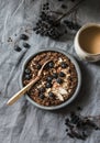 Served healthy vegetarian breakfast - chocolate overnight oats and coffee on a grey background, top view. Flat lay Royalty Free Stock Photo