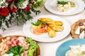 Served for holiday banquet restaurant table with baked mussels with cheese and garlic bread, meat plate dishes, cold snack, salads Royalty Free Stock Photo