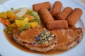 Served Pork Cutlet With Fried Potato Croquettes