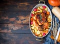 Served roasted Thanksgiving Turkey with vegetables on brown wooden rustic background. Royalty Free Stock Photo