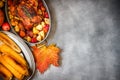 Served roasted Thanksgiving Turkey with vegetables and grilled corn on grey stone background Royalty Free Stock Photo