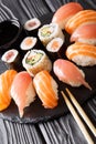 Served a set of sushi with salmon and tuna, California rolls, ma Royalty Free Stock Photo