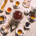 Served table with a cup of tea and chocolate cakes Royalty Free Stock Photo