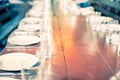 Served table with empty plates, glass goblets and, forks, knives. cutlery in the restaurant