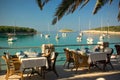 Served tables at yachting club beach restaurant