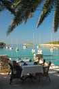 Served tables at yachting club beach restaurant