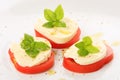 Served tomato with mozzarella and basil