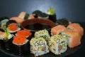 Set of sushi on a black plate. Japanese food Roll Maki Sushi with Wasabi, Caviar