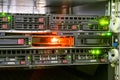 A server with multiple hard drives works in a data center rack. A place to connect hdd. Bright indication of a working access Royalty Free Stock Photo