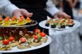 server offering hors doeuvres on platter Royalty Free Stock Photo