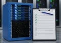 Server rack with checklist and pen for it management Royalty Free Stock Photo