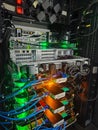 Server Rack with Complex Network Cables and Glowing Green Indicator Lights Royalty Free Stock Photo
