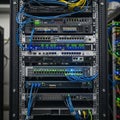 Server rack filled with various network hardware in a data center Royalty Free Stock Photo