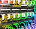 Server rack with rainbow internet patch cord cables Royalty Free Stock Photo