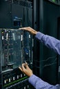 Server room, hardware or hands of technician fixing online cybersecurity glitch, machine or servers system. IT support Royalty Free Stock Photo