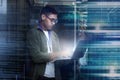 Server room, laptop and man with date overlay for cyber security, programming and writing software code. Technician Royalty Free Stock Photo