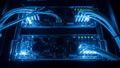 Server Room Network Rack with Blue Illuminated Cables and Blinking LED Lights Royalty Free Stock Photo