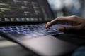 Server room programmer coding on laptop, typing on keyboard, close up Royalty Free Stock Photo