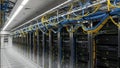 Server room with rows of computer servers and cables Royalty Free Stock Photo