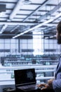 Server room worker oversees AI systems processing information Royalty Free Stock Photo
