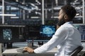 Server room worker uses AI powered data visualization to perform computing tasks Royalty Free Stock Photo