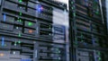 Server units in cloud service data center showing flickering light indicators for massive data connection bandwidth, close up shot