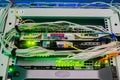 Servers and switches operating in a rack of server room Royalty Free Stock Photo