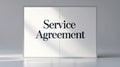 Service agreement document on a tabletop with soft shadow effect in morning light
