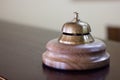 Service bell in a hotel reception for concierge alarm on desk. Royalty Free Stock Photo