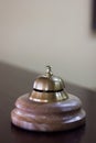 Service bell in a hotel reception for concierge alarm on desk. Royalty Free Stock Photo