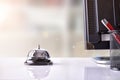 Service bell on hotel reception with other objects Royalty Free Stock Photo