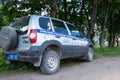 Service car of the rural district police Commissioner Chevrolet Niva with a spare wheel on the back of the door.