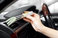 Service car wash, girl worker cleaning air conditioning ventilation brush Royalty Free Stock Photo