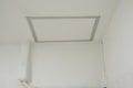The service ceiling square shape white color with aluminium frame in building. aircondition tube connect to compressor on wall. No Royalty Free Stock Photo