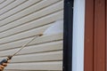 Service for cleaning siding houses on a regular basis by using high pressure nozzles that spray soap and water to clean