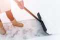 Service cleaning snow winter with shovel after snowstorm. Snow removal in wintertime. Working cleaning the road from snow. Gardene Royalty Free Stock Photo