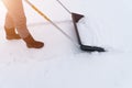 Service cleaning snow winter with shovel after snowstorm. Snow removal in wintertime. Working cleaning the road from snow. Gardene Royalty Free Stock Photo