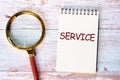 SERVICE concept A word SERVICE written on a blank sheet of notepad Royalty Free Stock Photo