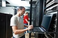 Service engineer in server room Royalty Free Stock Photo