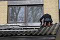 Installing solar panels on the rooftop of a house Royalty Free Stock Photo