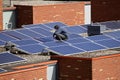 Installing solar panels on the rooftop of a house Royalty Free Stock Photo