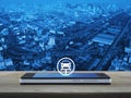 Service fix car with wrench tool icon on modern smart mobile phone screen on wooden table over city tower, street, expressway and