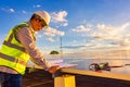 Service and maintenance engineer for solar rooftop system checking energy performance of solar cell panels Royalty Free Stock Photo